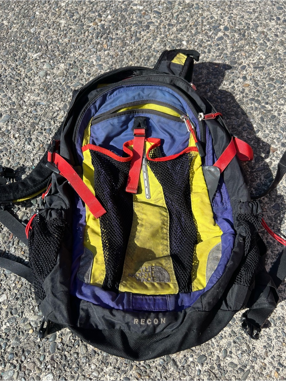 The North Face Recon Backpack in Black, Yellow, Purple & Red